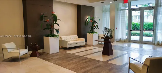 a view of an entrance to house with yard