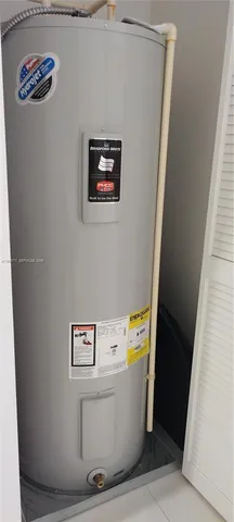 a kitchen with a table and chairs in it