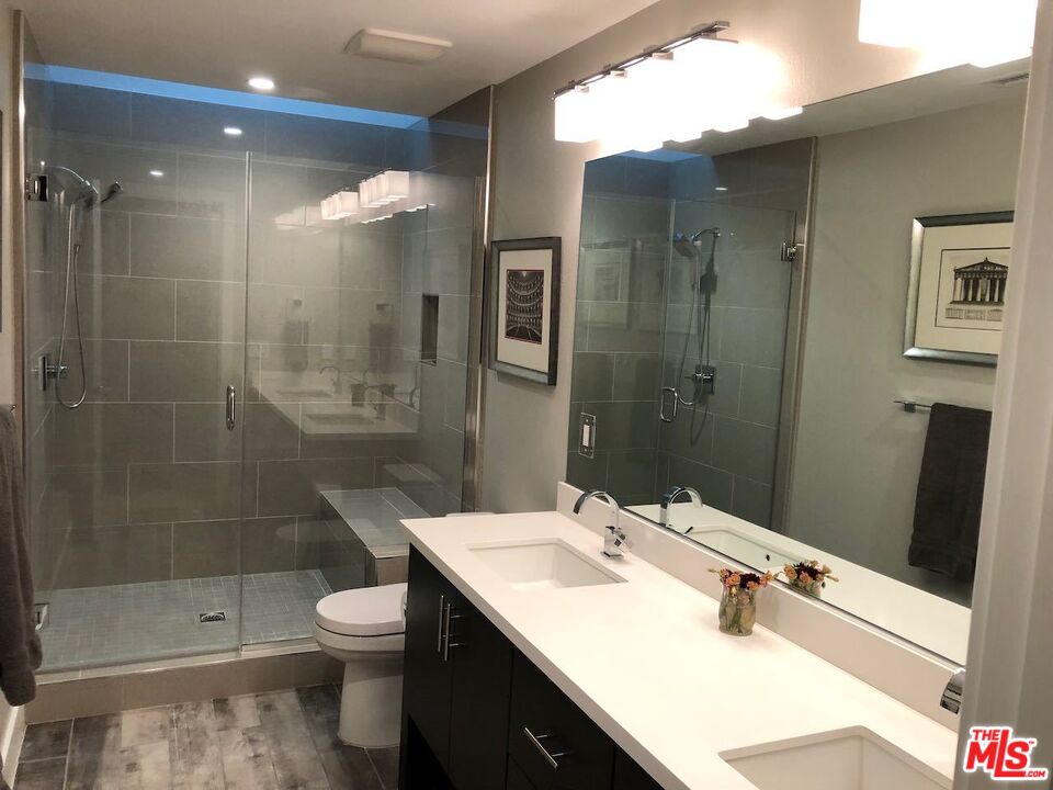 12003 Emery Lane Valley Village, CA 91607 - Photo 17 of 22 a bathroom with a sink toilet and shower