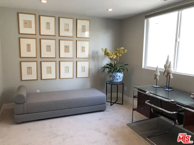 a view of roof deck with couches table and chairs