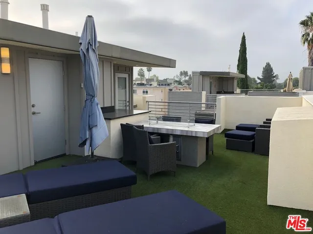 a kitchen with a sink and a refrigerator