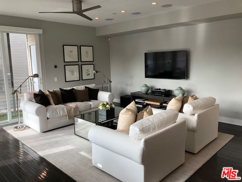 12003 Emery Lane Valley Village, CA 91607 - Photo 4 of 22 a living room with furniture and a flat screen tv
