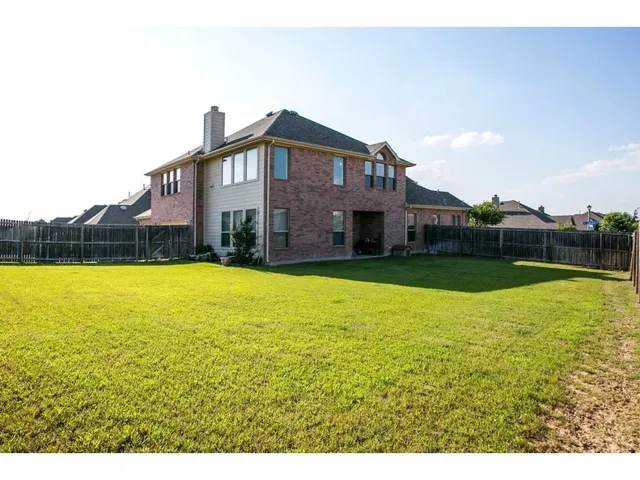 a view of a house with a garden