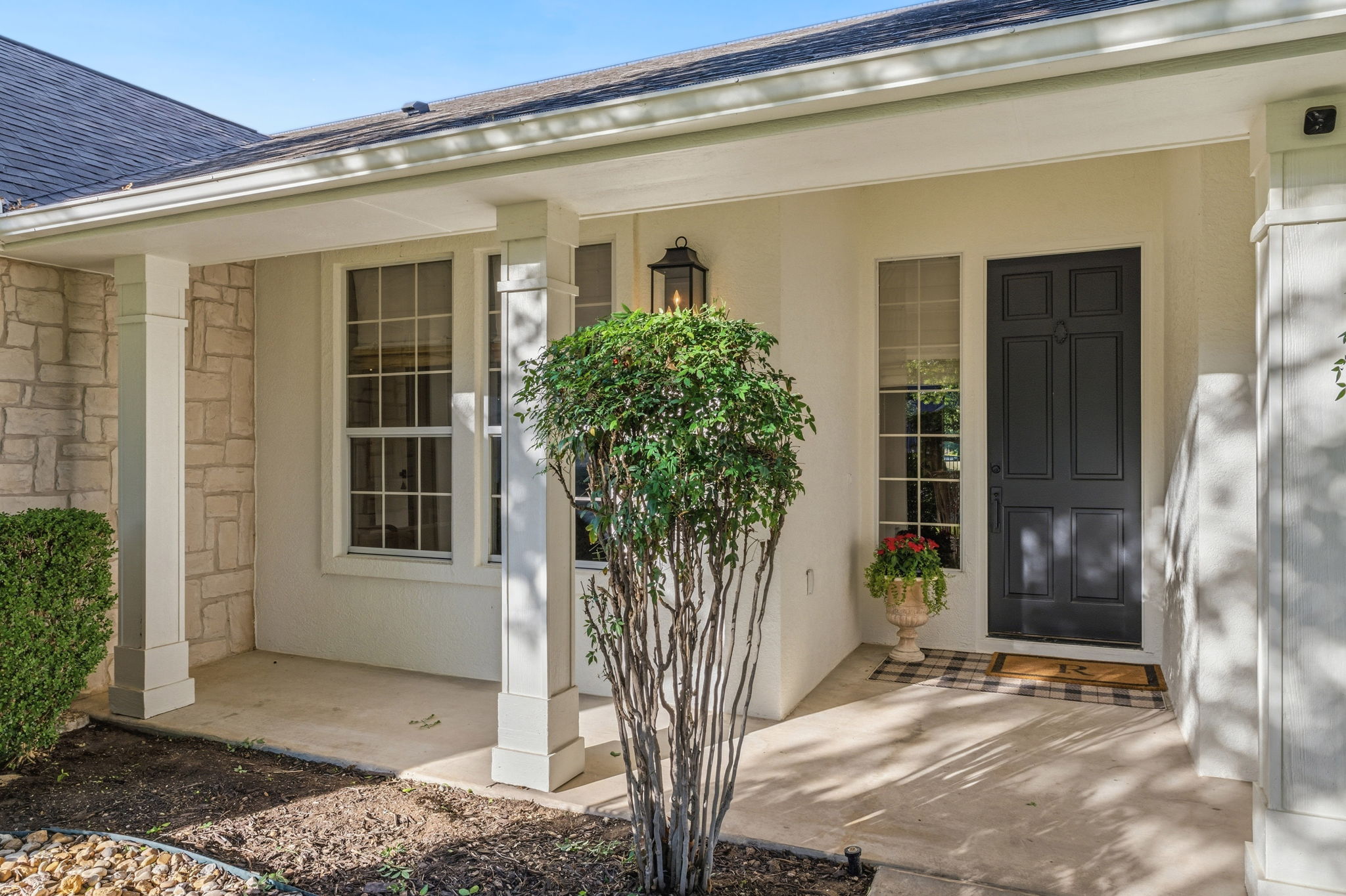 118 Cold Springs Drive Georgetown, TX 78633 - Photo 3 of 40 A welcoming front entry with a dark door, stone accents, and ample natural light beckons.