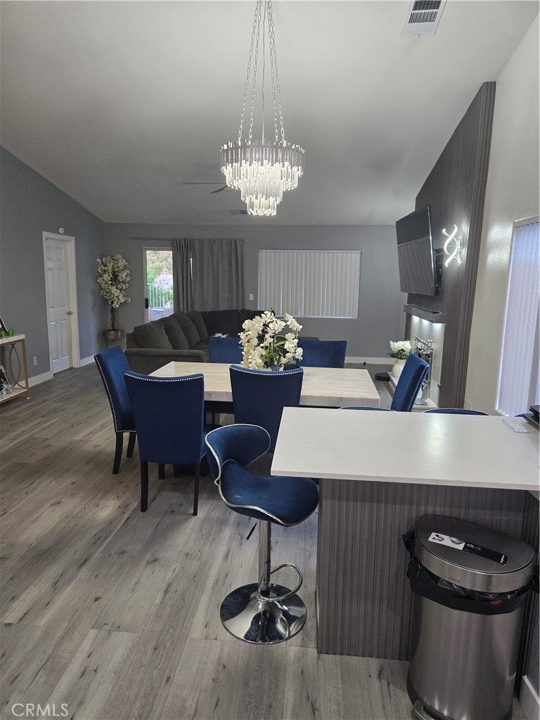 33860 Bell Thousand Palms, CA 92276 - Photo 13 of 49 a dining room with furniture and chandelier