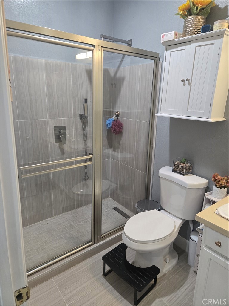 33860 Bell Thousand Palms, CA 92276 - Photo 15 of 49 a bathroom with a toilet and a shower