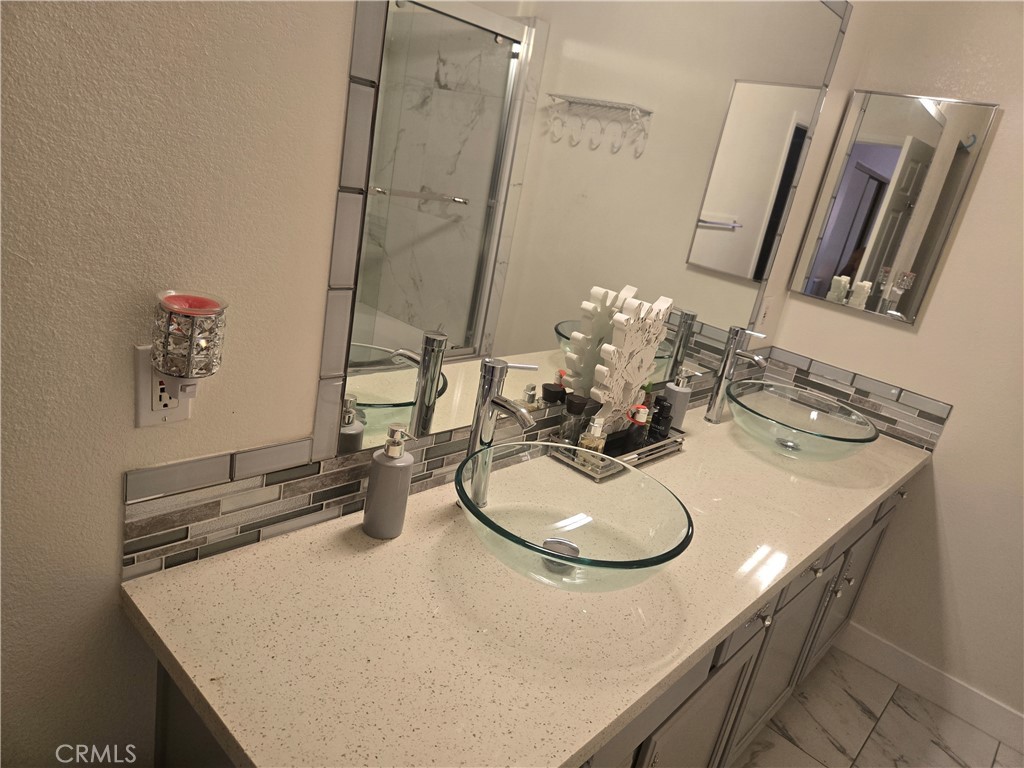 33860 Bell Thousand Palms, CA 92276 - Photo 18 of 49 a bathroom with a sink and mirror