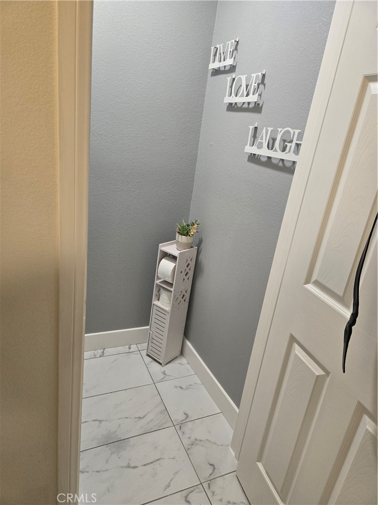 33860 Bell Thousand Palms, CA 92276 - Photo 22 of 49 a bath room with a door