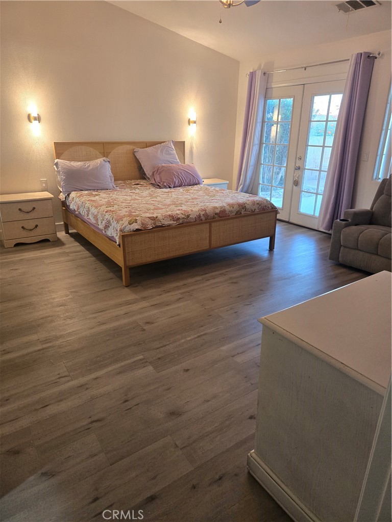 33860 Bell Thousand Palms, CA 92276 - Photo 24 of 49 a bedroom with a bed and large mirror in it