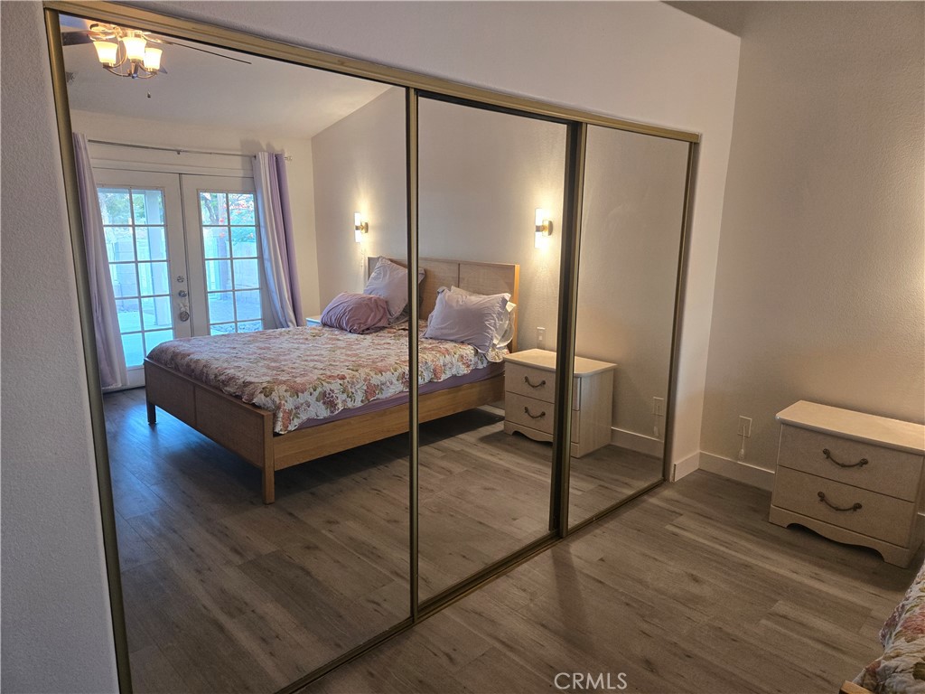 33860 Bell Thousand Palms, CA 92276 - Photo 25 of 49 a bedroom with a bed and large mirror on dresser