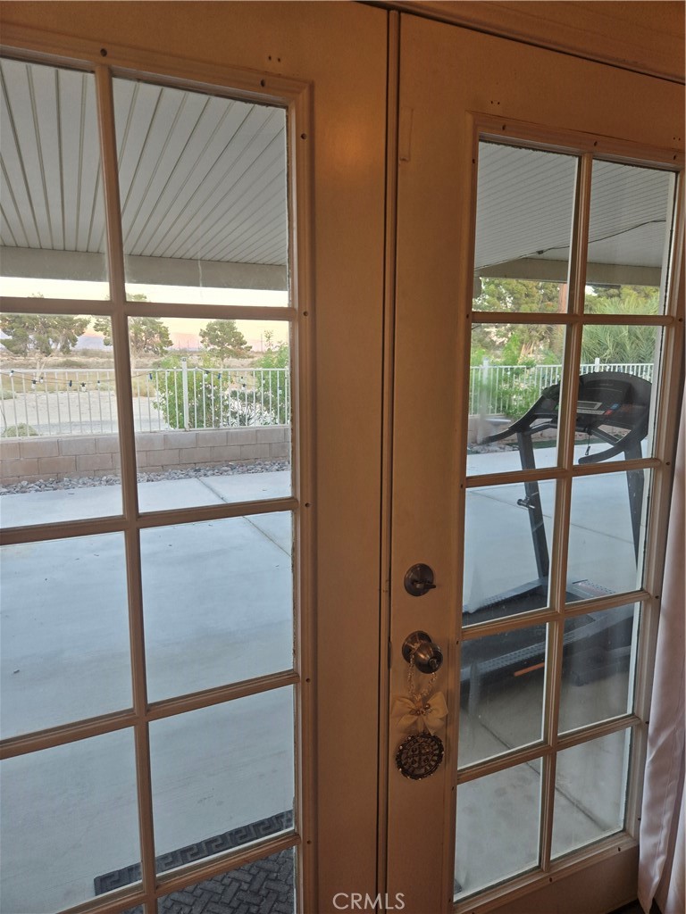 33860 Bell Thousand Palms, CA 92276 - Photo 27 of 49 a view of a glass door with a yard