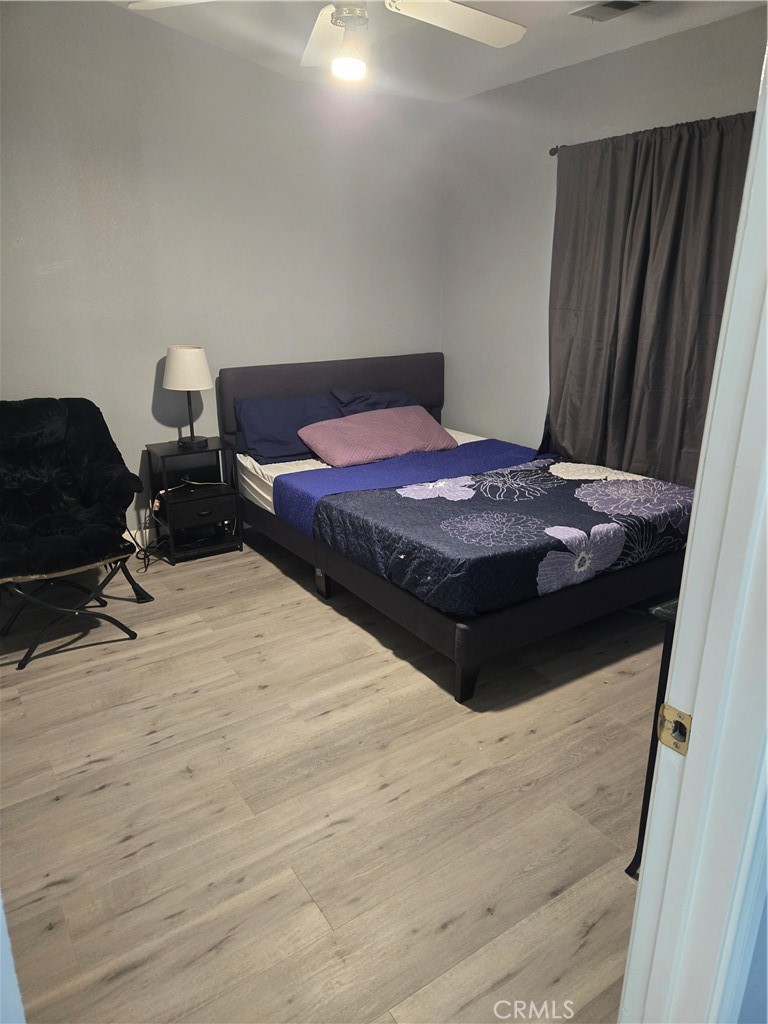 33860 Bell Thousand Palms, CA 92276 - Photo 31 of 49 a bedroom with a bed and chair