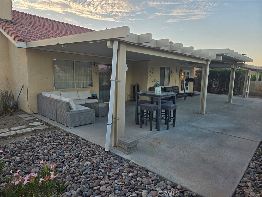 33860 Bell Thousand Palms, CA 92276 - Photo 33 of 49 a view of a patio with table and chairs