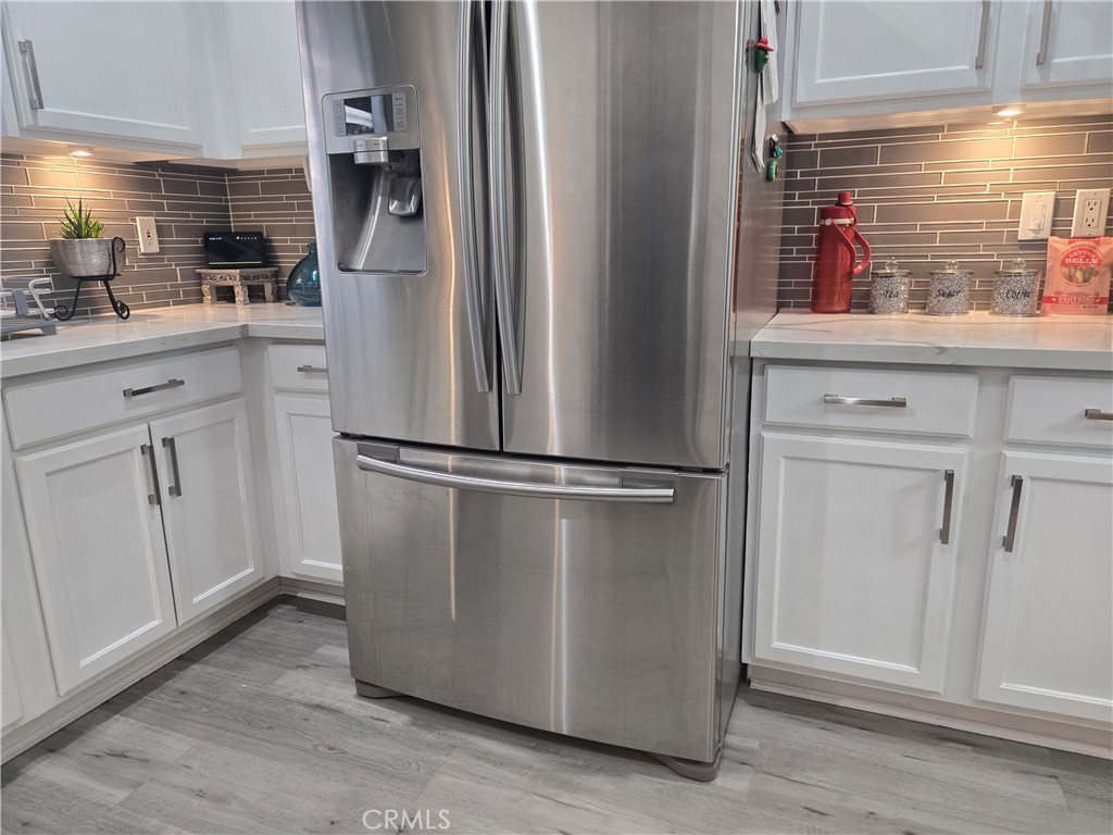 33860 Bell Thousand Palms, CA 92276 - Photo 43 of 49 a kitchen with a refrigerator and cabinets