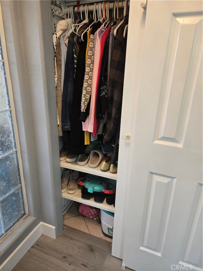 33860 Bell Thousand Palms, CA 92276 - Photo 46 of 49 a view of walk in closet with clothes and shoes