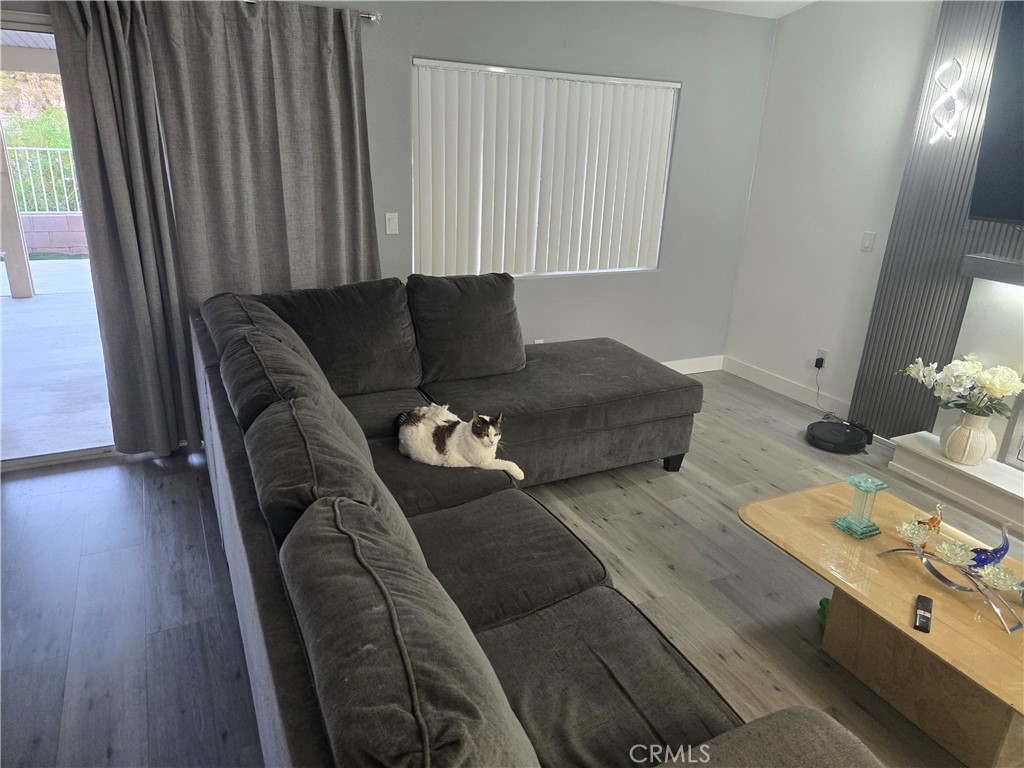 33860 Bell Thousand Palms, CA 92276 - Photo 7 of 49 a living room with furniture and wooden floor