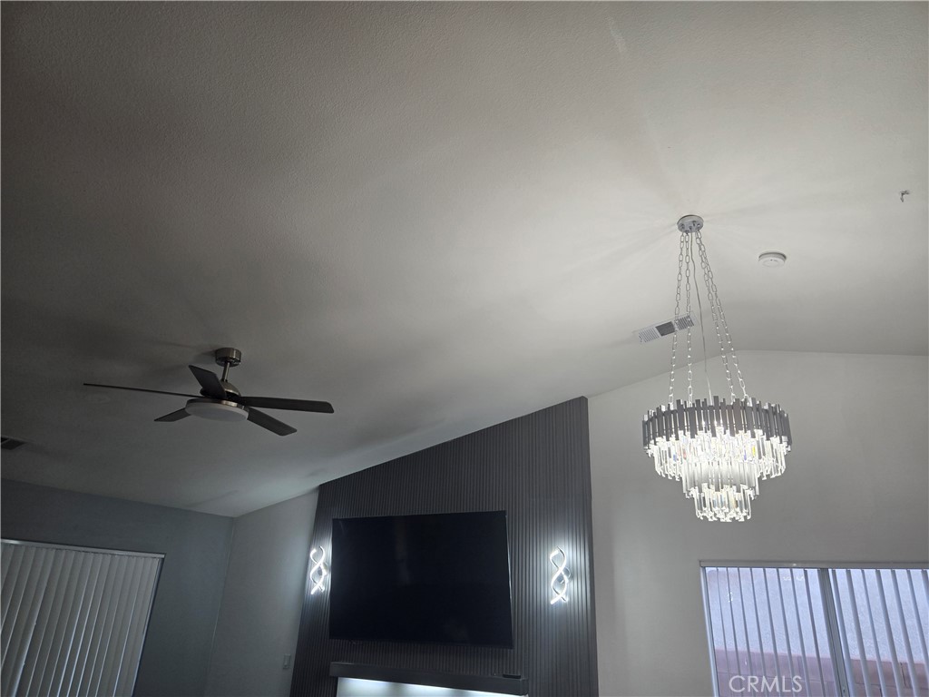 33860 Bell Thousand Palms, CA 92276 - Photo 8 of 49 a view of a chandelier fan and fire place