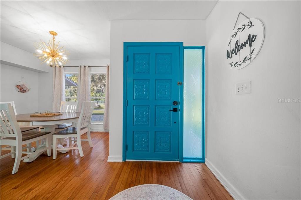 2475 Southwest 7th Avenue Ocala, FL 34471 - Photo 2 of 35 a view of a room with wooden floor and a window