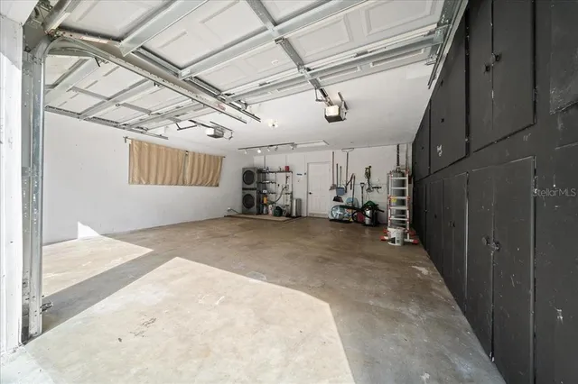 a view of hallway with wooden stairs
