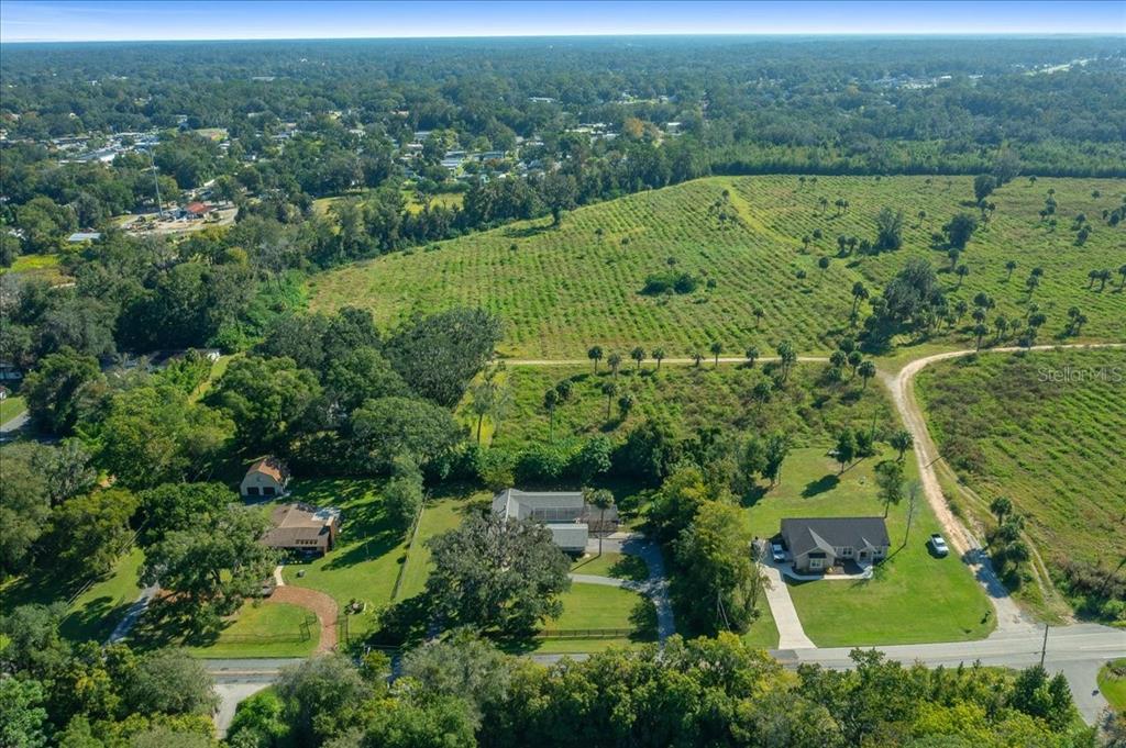 2475 Southwest 7th Avenue Ocala, FL 34471 - Photo 33 of 35 an aerial view of residential houses with outdoor space and trees