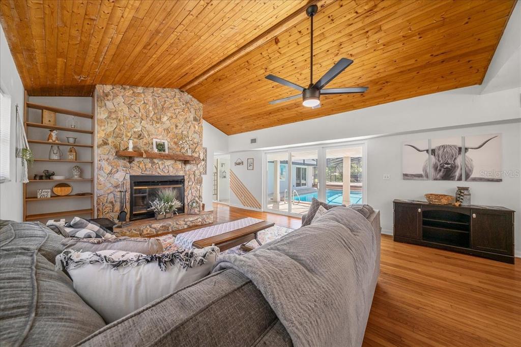 2475 Southwest 7th Avenue Ocala, FL 34471 - Photo 4 of 35 a living room with furniture and a fireplace