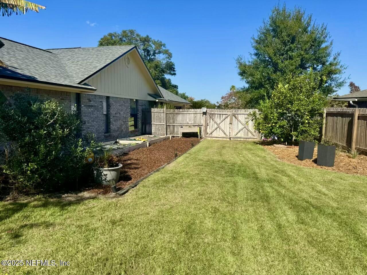 2587 Bayou Ridge Court Orange Park, FL 32065 - Photo 12 of 40 a view of a house with backyard and sitting area