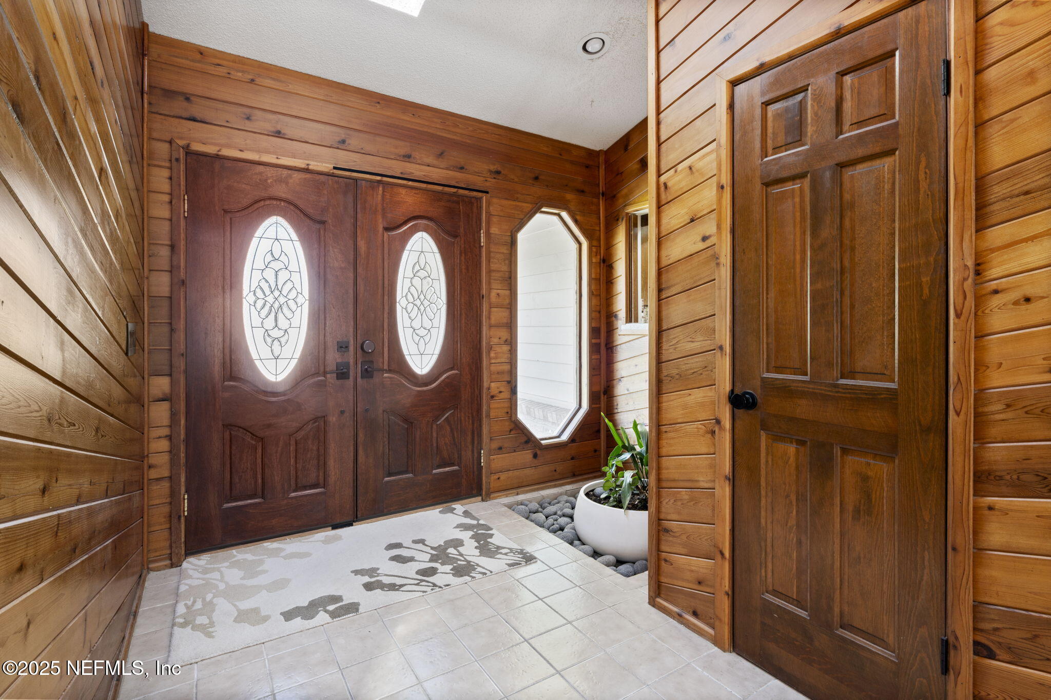 2587 Bayou Ridge Court Orange Park, FL 32065 - Photo 15 of 40 a living room with painting on the wall and a large mirror
