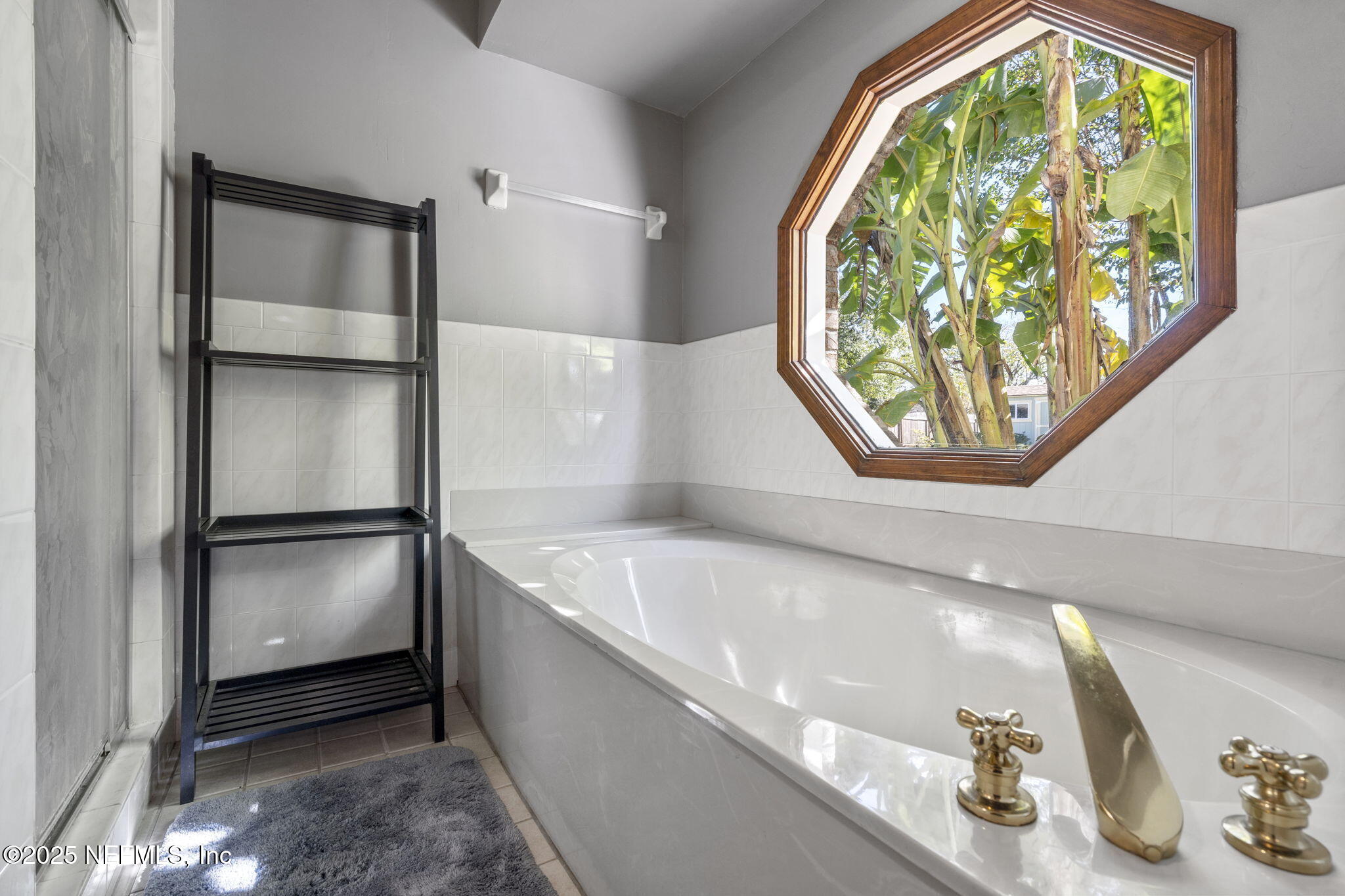 2587 Bayou Ridge Court Orange Park, FL 32065 - Photo 20 of 40 a kitchen with a refrigerator and window