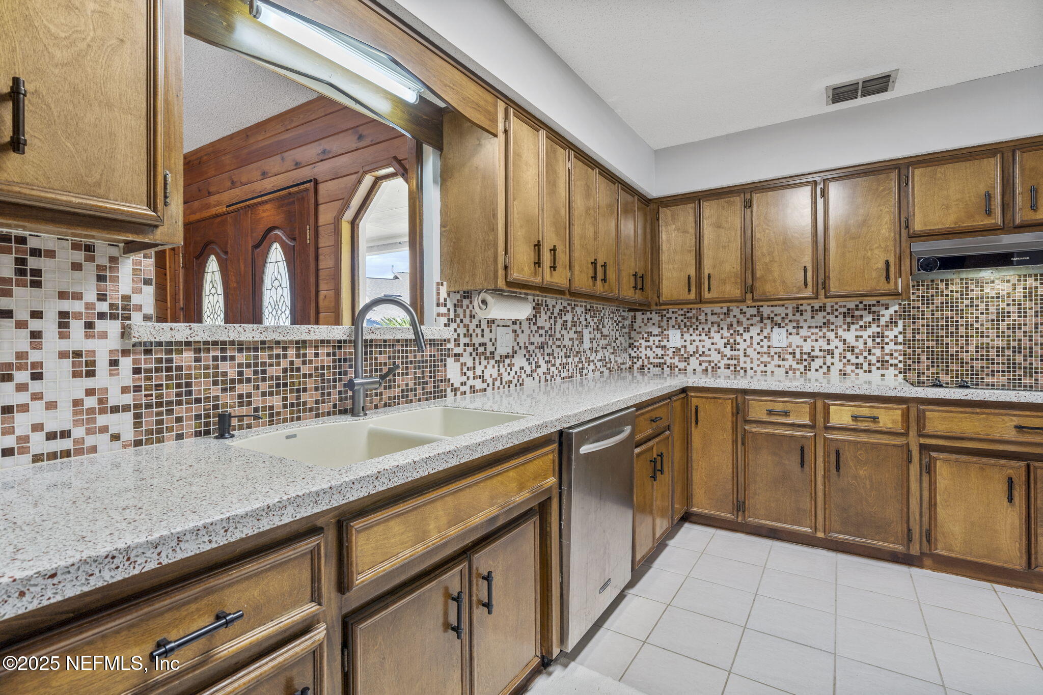 2587 Bayou Ridge Court Orange Park, FL 32065 - Photo 24 of 40 a kitchen with stainless steel appliances granite countertop a sink stove and cabinets