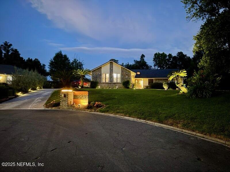 2587 Bayou Ridge Court Orange Park, FL 32065 - Photo 35 of 40 a view of a street with houses on both side of the road