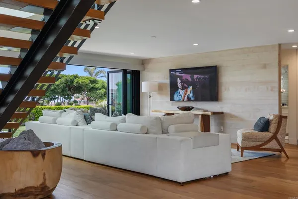 a living room with furniture and a large window