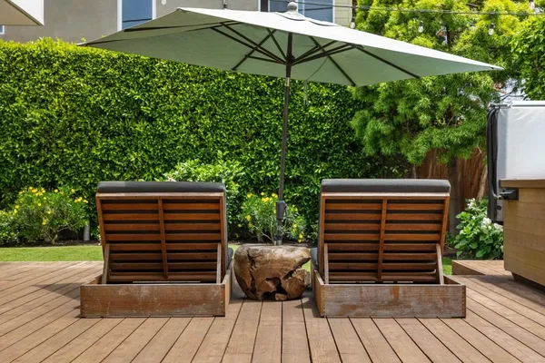 a view of a house with sitting area and garden