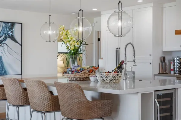 a dining room with furniture and chandelier