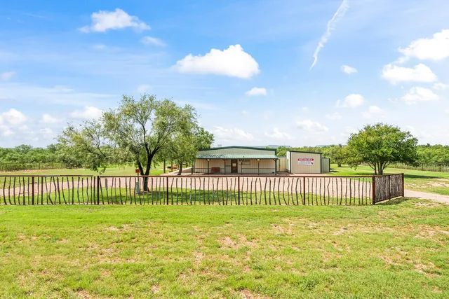 a view of a lake with a yard
