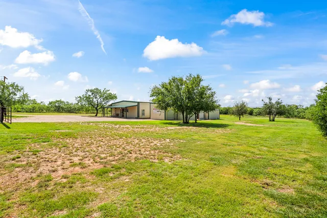 an aerial view of a house with a garden