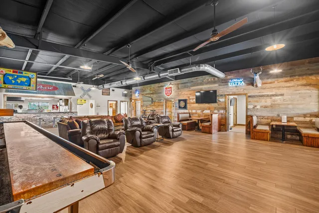 a view of a gym with wooden floor