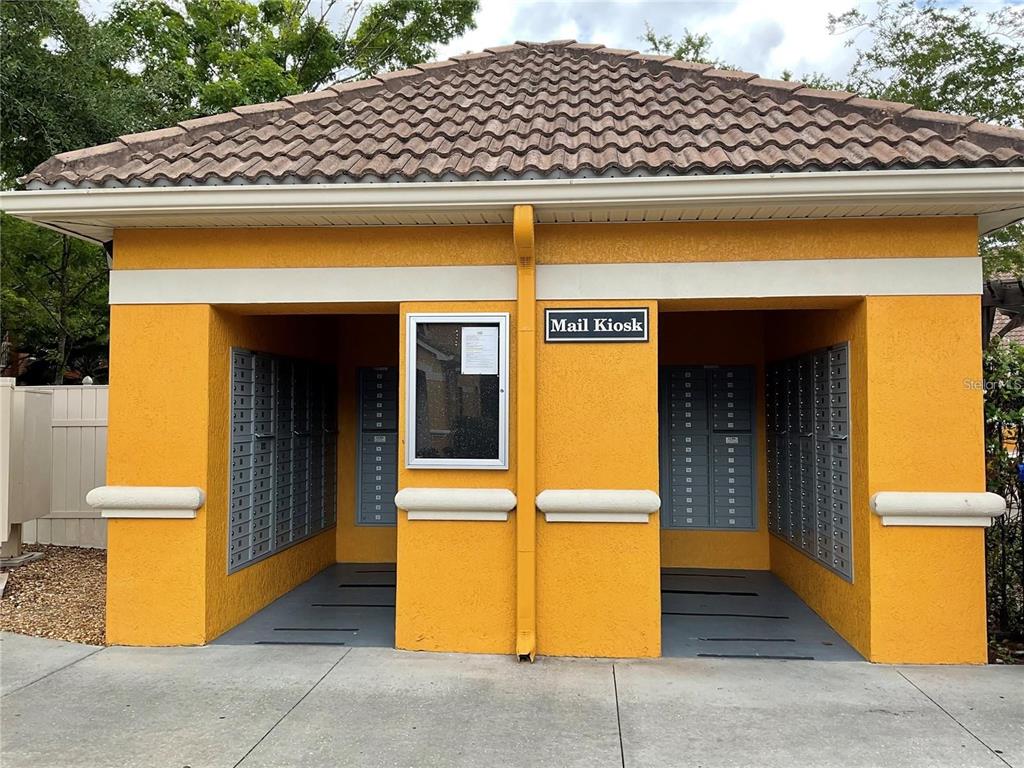 8813 Villa View Circle, Unit 104 Orlando, FL 32821 - Photo 11 of 14 a front view of a house with parking