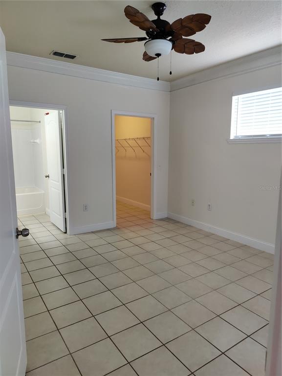 8813 Villa View Circle, Unit 104 Orlando, FL 32821 - Photo 6 of 14 a view of an empty room and window