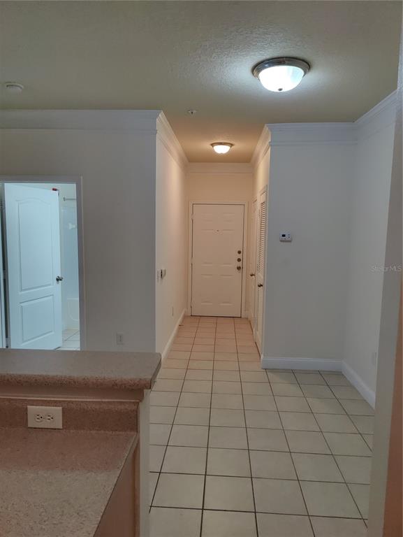 8813 Villa View Circle, Unit 104 Orlando, FL 32821 - Photo 8 of 14 a view of a livingroom with an empty space and a window