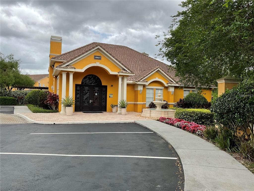 8813 Villa View Circle, Unit 104 Orlando, FL 32821 - Photo 10 of 14 a front view of house with outdoor space and street view