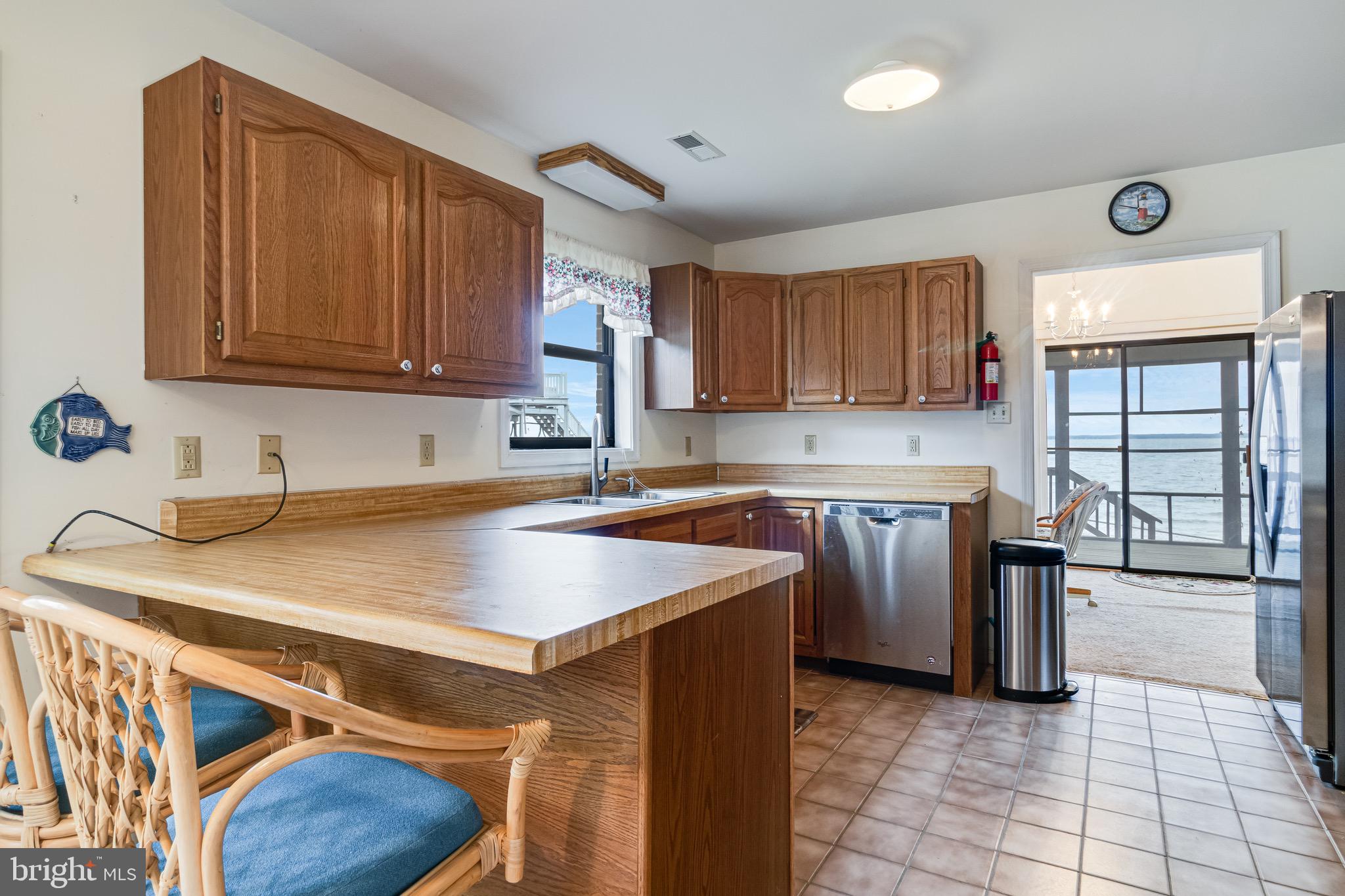 899 North Glebe Road Montross, VA 22520 - Photo 25 of 57 a kitchen with stainless steel appliances granite countertop a sink stove and cabinets