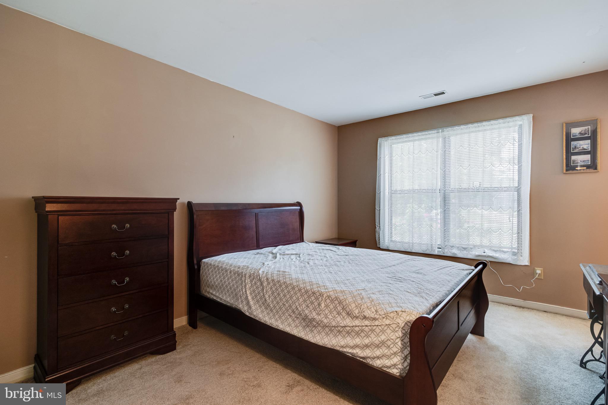 899 North Glebe Road Montross, VA 22520 - Photo 8 of 57 a bedroom with a bed and window
