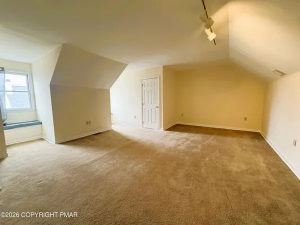 an empty room with entrance door