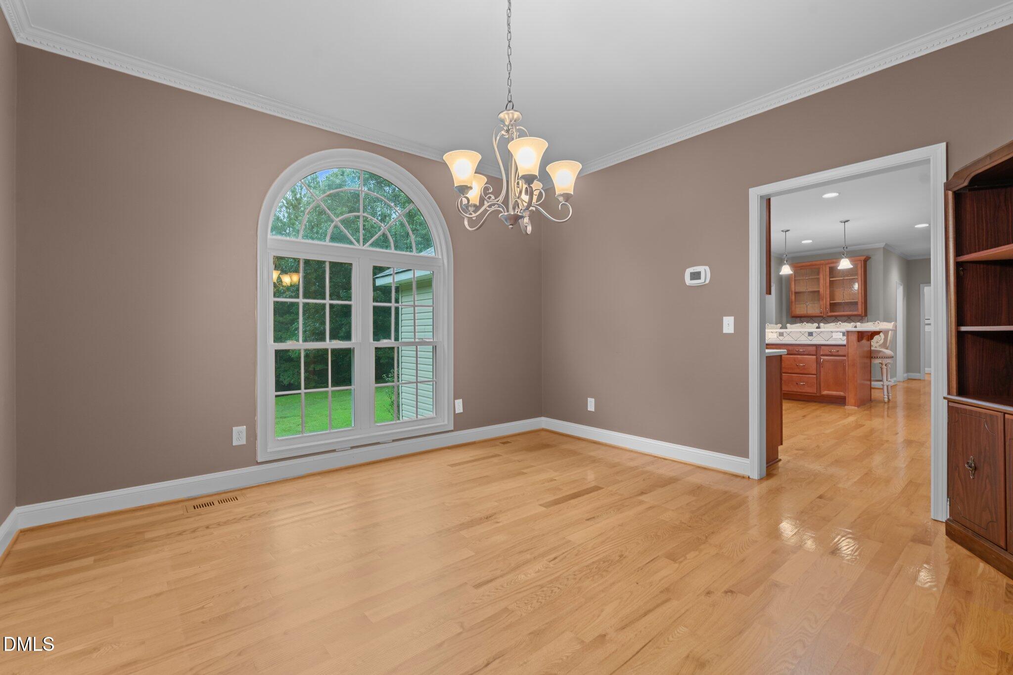 431 Patterson Ridge Lane Sanford, NC 27330 - Photo 8 of 29 a view of an empty room with a window