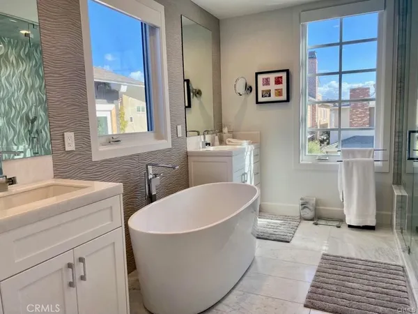 a bathroom with a sink a toilet and a window