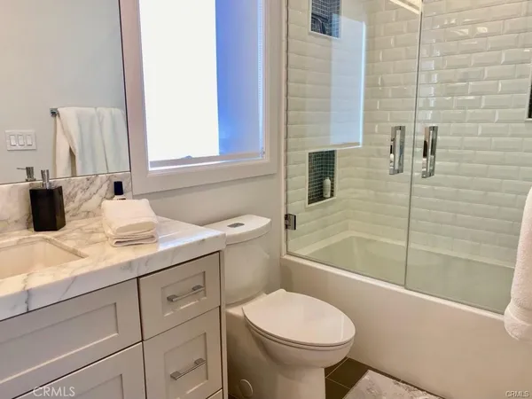 a bedroom with a bed and walk in closet