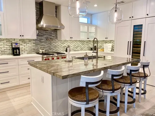 a kitchen with a sink cabinets and window