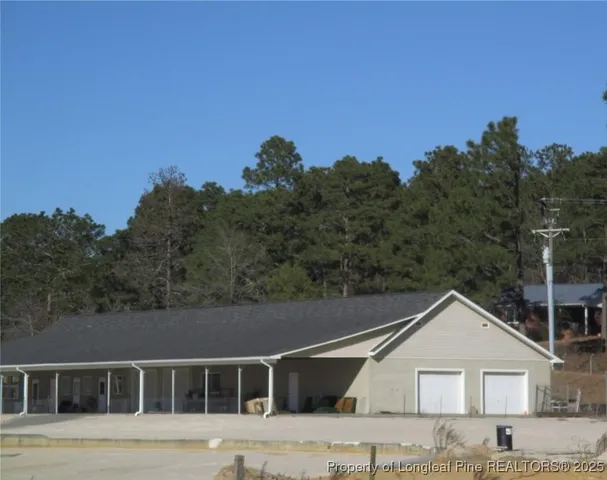 a view of house with outdoor space