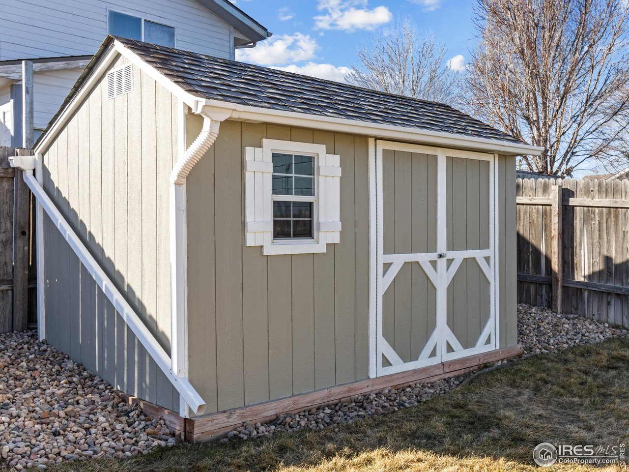 4610 Homestead Court Greeley, CO 80634 - Photo 15 of 18 a view of a house with wooden fence