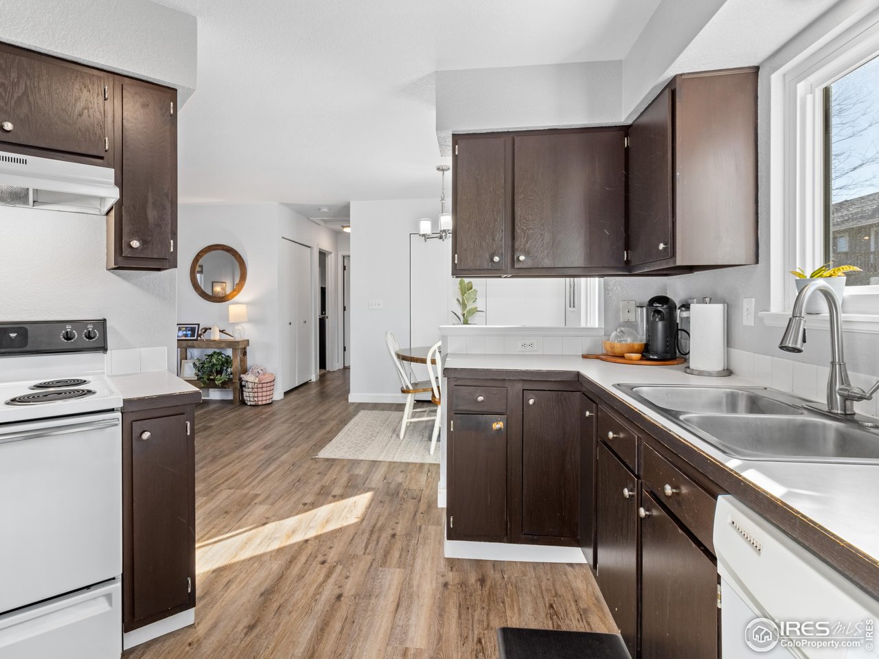 4610 Homestead Court Greeley, CO 80634 - Photo 5 of 18 a kitchen with stainless steel appliances granite countertop a sink stove and refrigerator